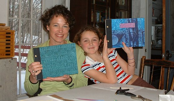This proud mother-daughter team show their new handmade journals.